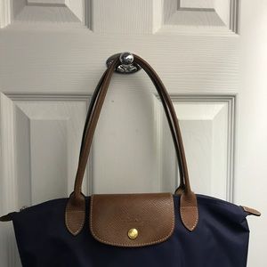 Navy Longchamp. Small with long handles.